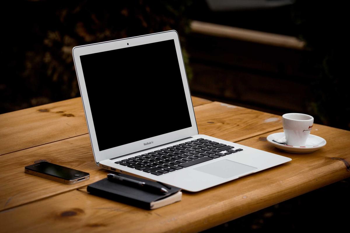 Desk with a laptop and notebook — placeholder image